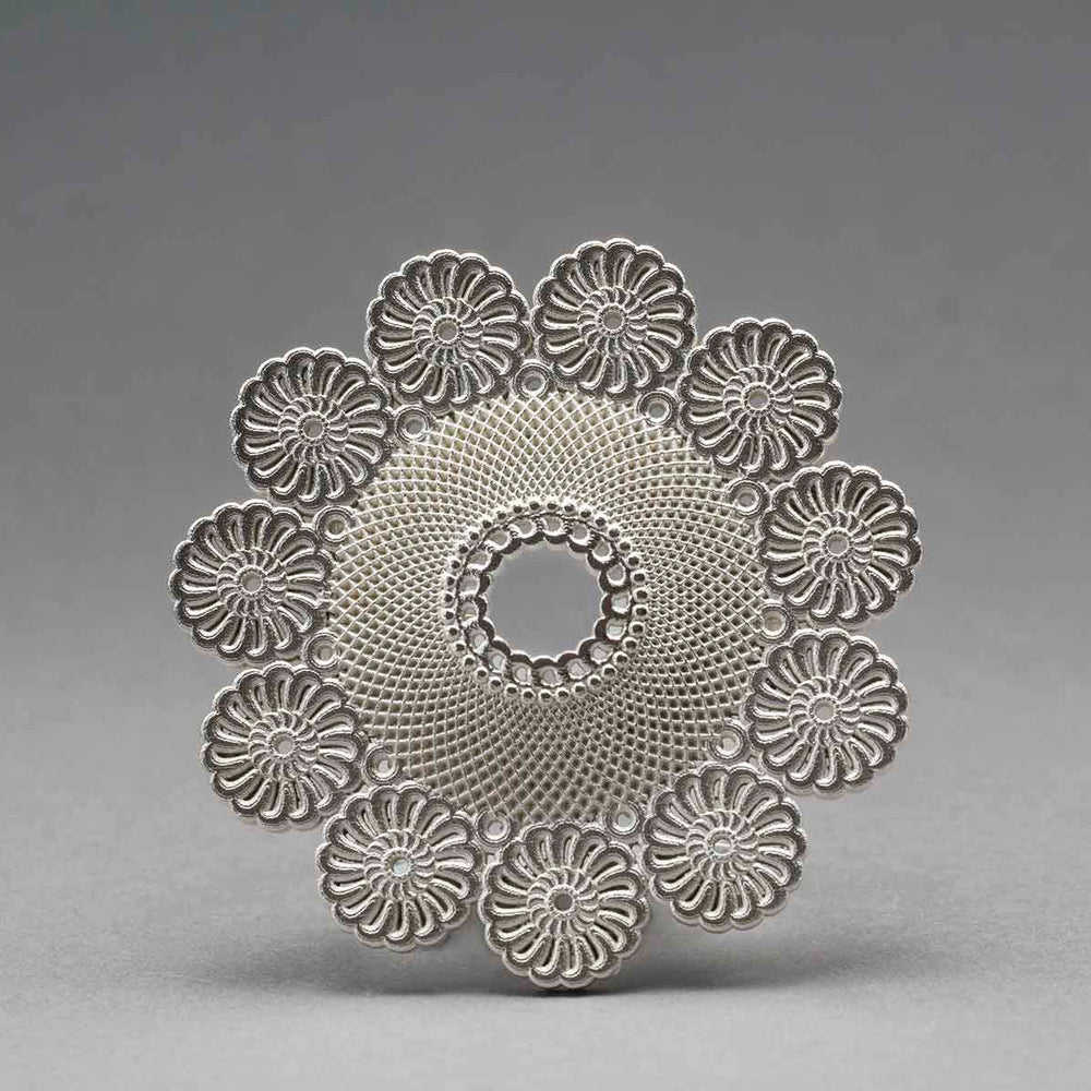 Lace Star - Rigel. | Materials: 925 Silver. | Dimensions 45mm x 45mm x 10mm. | Year 2011. | Photographer: Rod Buchholz
